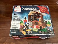 Front view of the LEGO Creator 40106 box showing artwork of the toy workshop, elves, toys, and limited edition 2014 seal.