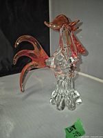 Murano glass rooster figurine, clear glass body with amber glass comb and tail, viewed from front angle