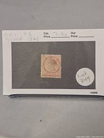 Photo of the Prince Edward Island 2 pence rose stamp issued in 1862, mounted on a card with catalog information and lot number indicated.