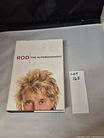 Front cover of the hardcover book titled 'Rod The Autobiography' by Rod Stewart, showing his head with spiky blond hair.