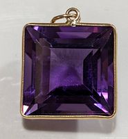 Front view of pendant showing square amethyst and bezel setting