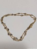 Full view of 18" chain with multiple diamonds on white background