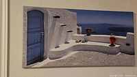 Canvas print in very good condition showing a white and blue typical Santorini scene on stretched canvas.