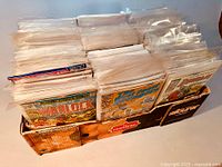 Long tray of bagged comics showing multiple rows and front issues Warlock, West Coast Avengers and Deathlok Special