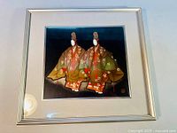 Full front image of framed artwork showing two Noh dancers in traditional dress with floral designs and glossy black lacquer background.