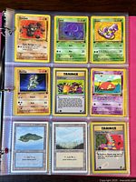 Clear binder pages holding Pokémon and Magic: The Gathering cards shown from the front side, featuring a range of Pokémon creatures and Trainer cards.