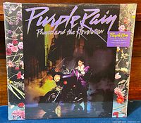 Front view of the Purple Rain album cover sealed in factory shrink-wrap with hype sticker visible