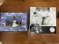 Box of 25 G40 transparent globe light bulbs in original box.