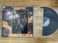 Photo of Duran Duran vinyl records, including a 12" single and an album vinyl with cover art and visible records.