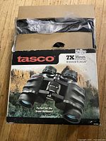 Front of original Tasco box showing 7x35mm Essentials binoculars image and text