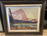 Framed print showing stylized mountain landscape titled 'Mountain Rain'