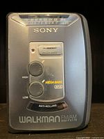 Front view of vintage Sony Walkman displaying Mega Bass controls, FM/AM tuning, and branding.
