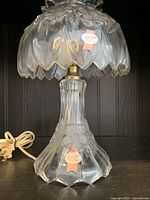 Front view of the vintage Anna Hutte bedside crystal lamp showing leaf patterned shade and overall design