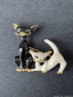 Vintage cat brooch black and white cats on black background