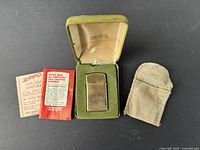 Full lot laid out: lighter in box, pouch and paperwork