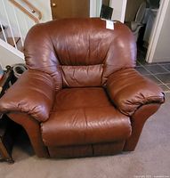 Front view of burgundy pleather reclining chair