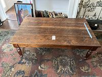 Top view showing the wide planked tabletop with natural wood grain and patina.