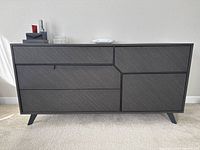 Full front view of dresser showing all drawers and cabinet door