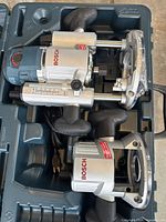 Bosch MRC23EVSK router and baseplate in molded plastic carrying case