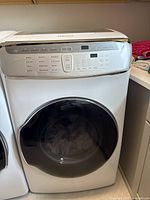 Front view of white Samsung top-load dryer