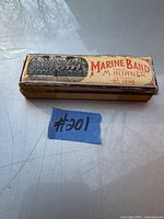 Top view of the original box showing 'Marine Band M. Hohner No 1896' text and visible wear on the edges.