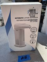 Front view of Pwr-Vie automatic lotion dispenser box showing product features and image of the dispenser.