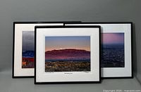 Three framed scenic photographs arranged slightly overlapping, showing overall condition and framing.