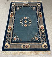 Full view of the vintage Chinese Art Deco rug showing design and colors.