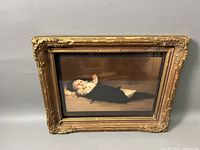 Photo showing the framed Louis Henri Deschamps baby giclee print on a gray background.