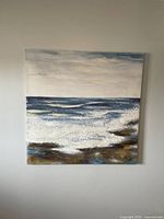 Full view of the 31x31 inch canvas art depicting ocean waves and rocky shore.