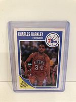 Front side of the 1989 Fleer Charles Barkley basketball card showing player image, team logo, and 'Offensive Rebound Leader' text.