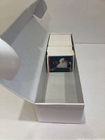 White box open showing around 200 1992 Upper Deck baseball cards stacked inside with a player in a Cincinnati Reds uniform visible on top.