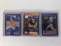 Front of three 1989 Donruss rookie baseball cards in protective cases showing Gregg Jefferies, Craig Biggio, and Gary Sheffield.