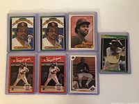Seven Tony Gwynn baseball cards displayed front side up, each in protective plastic cases, showing various designs and action shots.