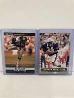 Front sides of two Bo Jackson NFL cards from 1990 Pro Set series in protective cases.