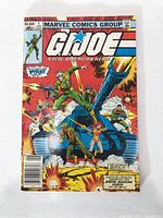 Front cover of G.I. Joe #1 showing team and battle tank
