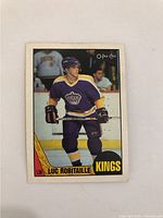 Front of 1997 Luc Robitaille rookie hockey card showing player in Los Angeles Kings uniform