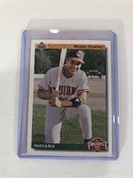 Front of the Manny Ramirez rookie card showing player in Indians uniform holding bat, in protective hard plastic case.