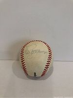 Signed side of the baseball showing Todd Stottlemyre's autograph.