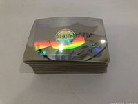 Stack of Upper Deck hologram baseball cards showing shiny holographic Philadelphia Phillies logo on the top card.