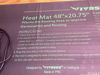 Close-up of Vivosun heat mat showing size and usage instructions printed on the mat surface.