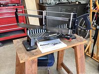 Mastercraft mitre box with hand saw placed on a wooden work table