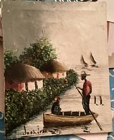 Front view of the oil painting showing a folk art water scene, signed bottom left as 'Joel Jean'. Features a man standing in a boat and thatched houses along a waterway.