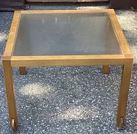Top view of square solid pine wood table with removable frosted glass inset top showing natural wood frame and glass.