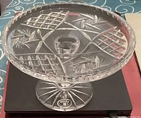 Crystal pedestal cake plate showing cut glass top design with hexagram and pinwheel shapes, includes original Bohemia label on base.
