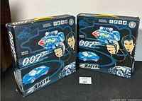 Two boxed 007 Racing Zone infrared remote control car sets showing the front box art with product images and graphics.