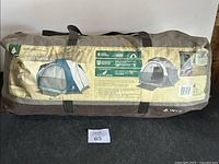 Closed carrying bag with label showing tent images and specifications