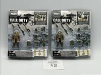 Two unopened Call Of Duty Mega Construx Winter Crate sets with contents visible in blister packaging, including soldier figures and multiple accessories.