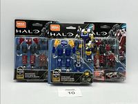 Three boxed Mega Construx Halo Pro Builder exosuit sets displayed in original packaging showing front view.
