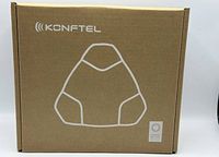 Closed original cardboard box with Konftel branding and outline of the conference phone.